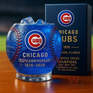 Chicago Cubs 1876-2026 150th Anniversary Whiskey Glass 7 A close up depiction of a Chicago Cubs one hundred fiftieth anniversary glass with ice placed in front of a themed box under bright stadium lights!