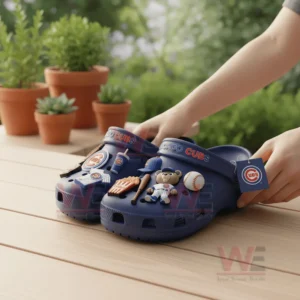 Chicago Cubs Crocs Crocband Clogs With Charms 8 Blue Chicago Cubs clogs held on a wooden table outdoors with plants in the background!