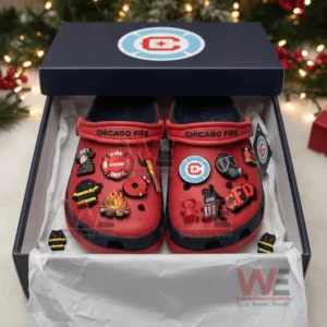 Red clogs with firefighter charms displayed inside a festive gift box!