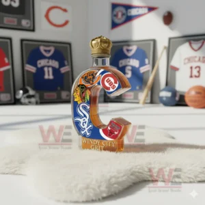 A detailed C shaped bottle featuring Chicago team symbols positioned on a white rug with sports themed displays behind it!