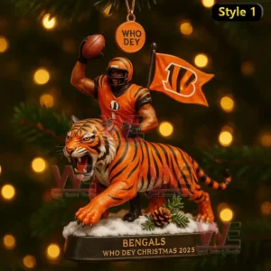 A Bengals themed Christmas ornament showing a football player and a roaring tiger with a flag and Who Dey tag above.