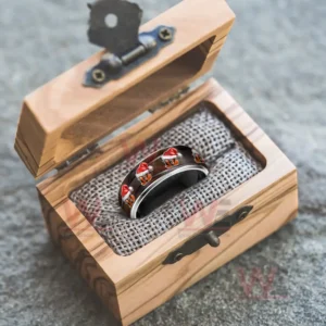 The Cincinnati Bengals Christmas-themed ring placed in a wooden jewelry box, highlighting its festive logo and design.