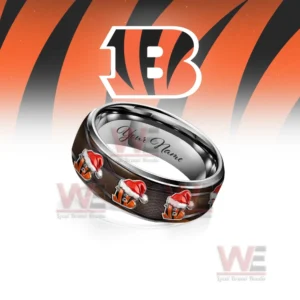 A close-up of a personalized Cincinnati Bengals Christmas-themed silver tungsten ring, showcasing the team logo and the space for engraving a name.