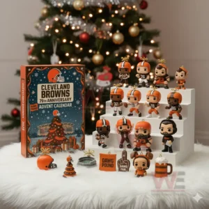 A set of Cleveland Browns holiday figurines and ornaments displayed next to an advent calendar box in front of a lit Christmas tree.