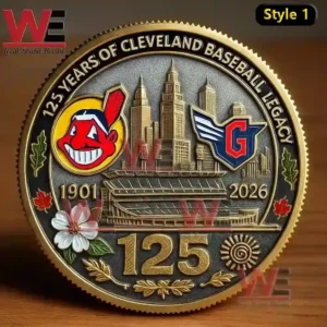 A gold toned commemorative coin displaying a city skyline a stadium team emblems floral decorations and the number one two five marking an anniversary!