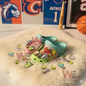 Two colorful clogs with cocktail charms displayed on a soft rug surrounded by loose charms and sports wall decorations!