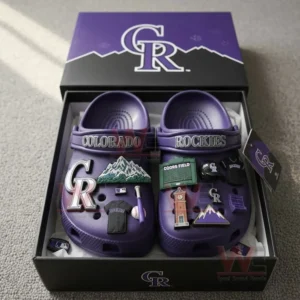 Purple Colorado Rockies Crocs with baseball-themed charms inside a purple box with the team logo.
