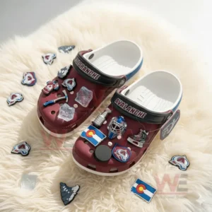 Colorado Avalanche-themed Crocs with hockey-related charms on a soft background.