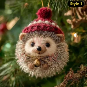 A hedgehog Christmas ornament wearing a red knit hat and gold bow on a tree!