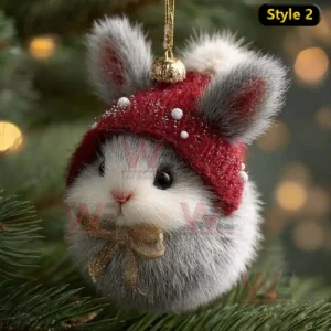 A rabbit ornament with a red hat and gold bow hanging on a Christmas tree!