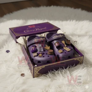 Purple themed clogs set inside an open box resting on a soft white rug!