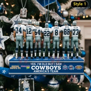 A Christmas ornament showing multiple Dallas Cowboys players standing together on a themed base with holiday decorations behind them!