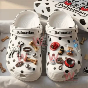 Close up of white spotted clogs decorated with Dalmatian and dog accessory charms!