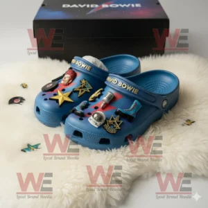 David Bowie Crocs Clogs with Charms 6 Blue David Bowie Crocs with themed charms on a fluffy white rug and a branded box in the background!
