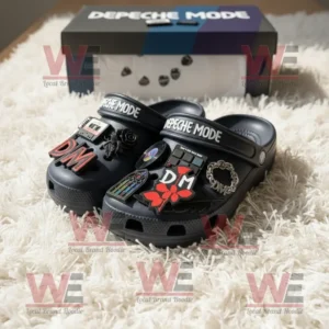 Black Depeche Mode Crocs with music themed charms and branded box on white fluffy surface!