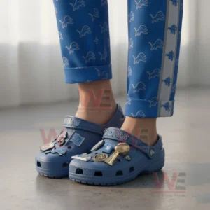 Detroit Lions Crocs Crocband Clogs With Charms 7 Person wearing blue Detroit Lions clogs with football charms standing indoors!