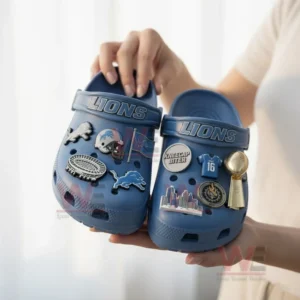 Detroit Lions Crocs Crocband Clogs With Charms 8 Blue Detroit Lions clogs with football charms held by a person indoors!