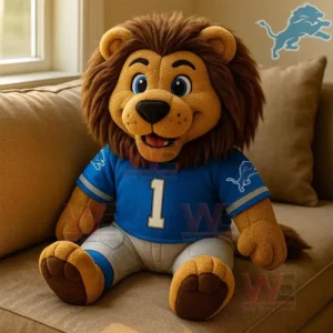 Detroit Lions Roary the Lion Plush Pillow 3 Detroit Lions plush lion mascot wearing a blue football jersey sitting on a sofa near a window.