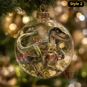 Alt text: Close-up of a Velociraptor dinosaur inside a glass ornament, hung on a Christmas tree.