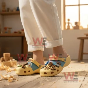 Alt text: Person wearing Disney Pinocchio crocs with charms in a wooden workshop surrounded by toys and tools.