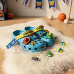 Blue Toy Story clogs with character charms displayed on a white furry rug in a playful room!