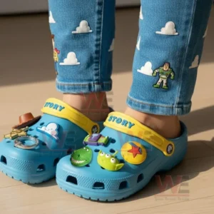 Disney Toy Story Crocs Crocband Clogs With Charms 7 Person wearing blue Toy Story clogs with character charms standing indoors!