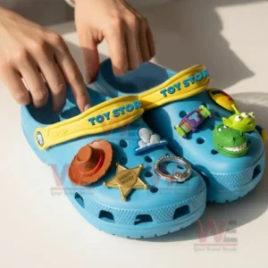 Disney Toy Story Crocs Crocband Clogs With Charms 8 Blue Toy Story clogs with character charms held by a person indoors!