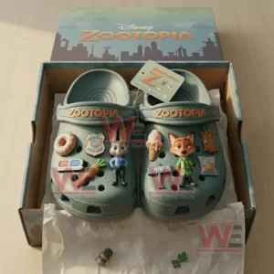 Disney Zootopia Premium Crocs Clogs With Charms 5 Alt text: Zootopia-themed crocs on a fluffy rug surrounded by charms like a donut, carrot, and police badge.