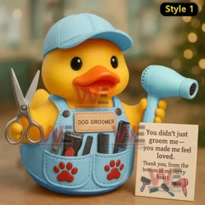 Rubber duck groomer in blue outfit holding scissors and blow dryer with a thank you sign beside it!