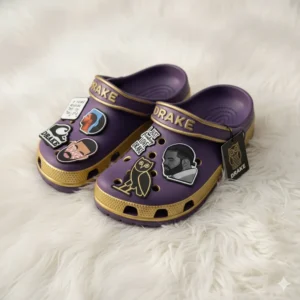 Close up purple gold Drake Crocs with owl and portrait charms!
