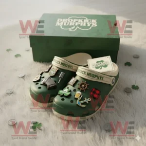 Green Dropkick Murphys Crocs with musical and Irish themed charms in front of matching box!