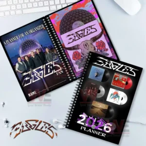 Multiple planners with assorted cover designs arranged on a desk!