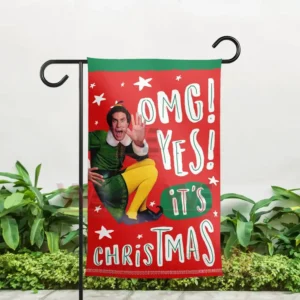 Alt text: Outdoor garden display of *Elf* movie flag with Buddy the Elf saying 