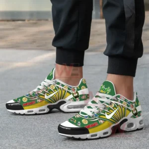 A close-up of a person wearing Elf-themed sneakers with Buddy the Elf and pizza illustrations.