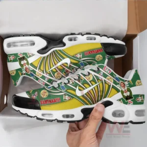 A pair of Elf-themed sneakers in a shoe box with holiday-themed designs.