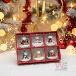 Elvis Presley Christmas ornament set of six pieces displayed in a red box on snow in front of a decorated Christmas tree with golden lights!