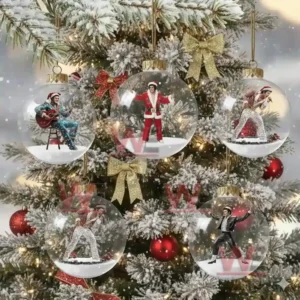 Snowy Christmas tree decorated with clear ornaments containing miniature performers in festive outfits!