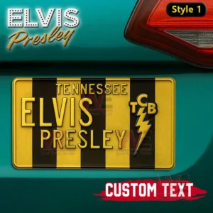 A yellow and black striped Elvis Presley themed license plate mounted on a teal car.