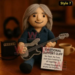 Emotional Support AC/DC Rock Band Doll 10 Crochet doll with black cap holding microphone and sign that says Emotional Support Brian in front of amplifier.