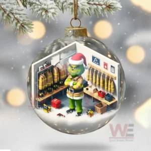 Firefighter Grinch Christmas Ornament 11 Clear ornament with a miniature firefighter locker room and a green character standing inside.