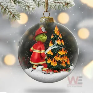 Firefighter Grinch Christmas Ornament 12 Clear ornament featuring a green firefighter character extinguishing a burning Christmas tree.