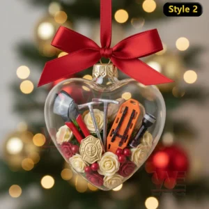 Alt text: A heart-shaped ornament with firefighter tools and a badge, decorated with red and yellow roses.