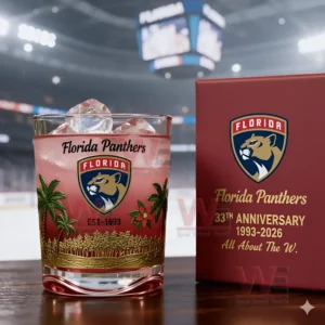 Florida Panthers 33th Anniversary Whiskey Glass 3 Commemorative Florida Panthers glass and box positioned on a table with an ice hockey arena in the background.