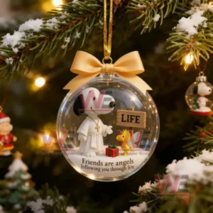 A close up of a hanging Snoopy ornament shaped like a clear ball featuring Snoopy and a small bird scene glowing among Christmas tree branches and festive lights.