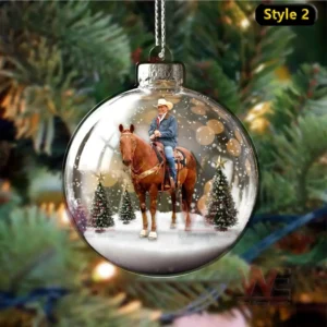 George Strait riding a horse in a snowy Christmas landscape.