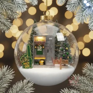 A clear ornament containing a Green Bay Packers locker scene with trees and snowy decorations!