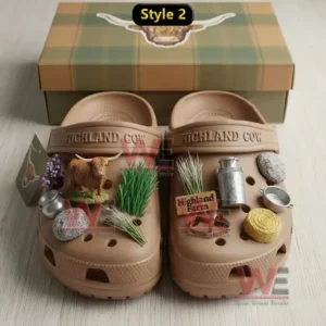 Brown clogs decorated with miniature farm charms displayed in a rustic themed box!