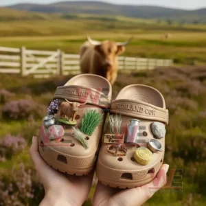 Brown farm themed clogs with countryside charms held before a scenic rural landscape!