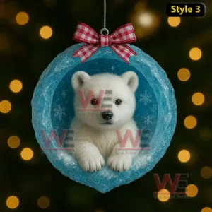 A baby penguin inside a blue ice cave ornament with a red check bow and warm lights behind it!