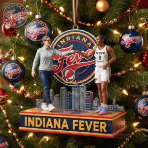 Alt text: A basketball ornament featuring a coach and player from the Indiana Fever, set against the team's logo and a city skyline, hanging on a Christmas tree.